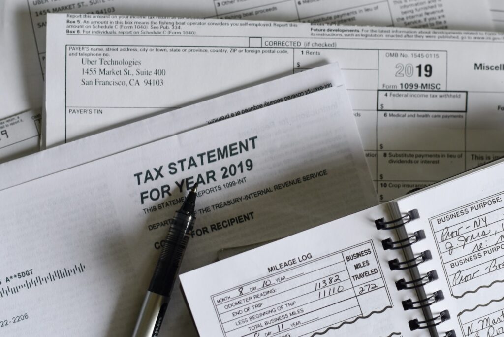 Image of tax documents with a pen on a desk